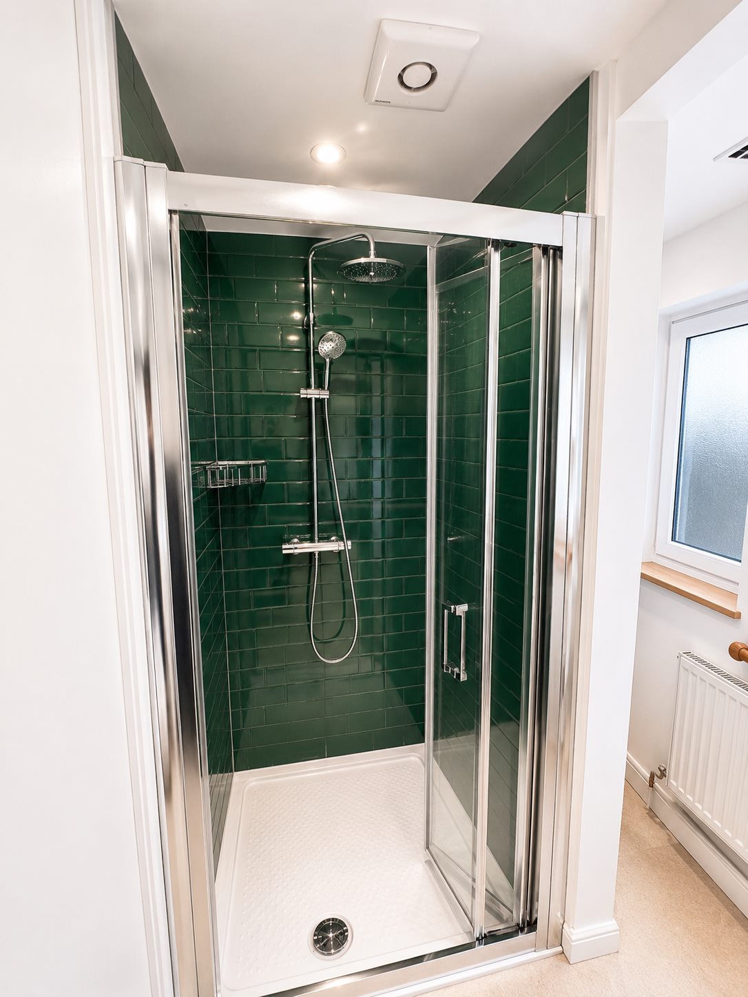 Walk-in shower enclosure and bathroom fittings