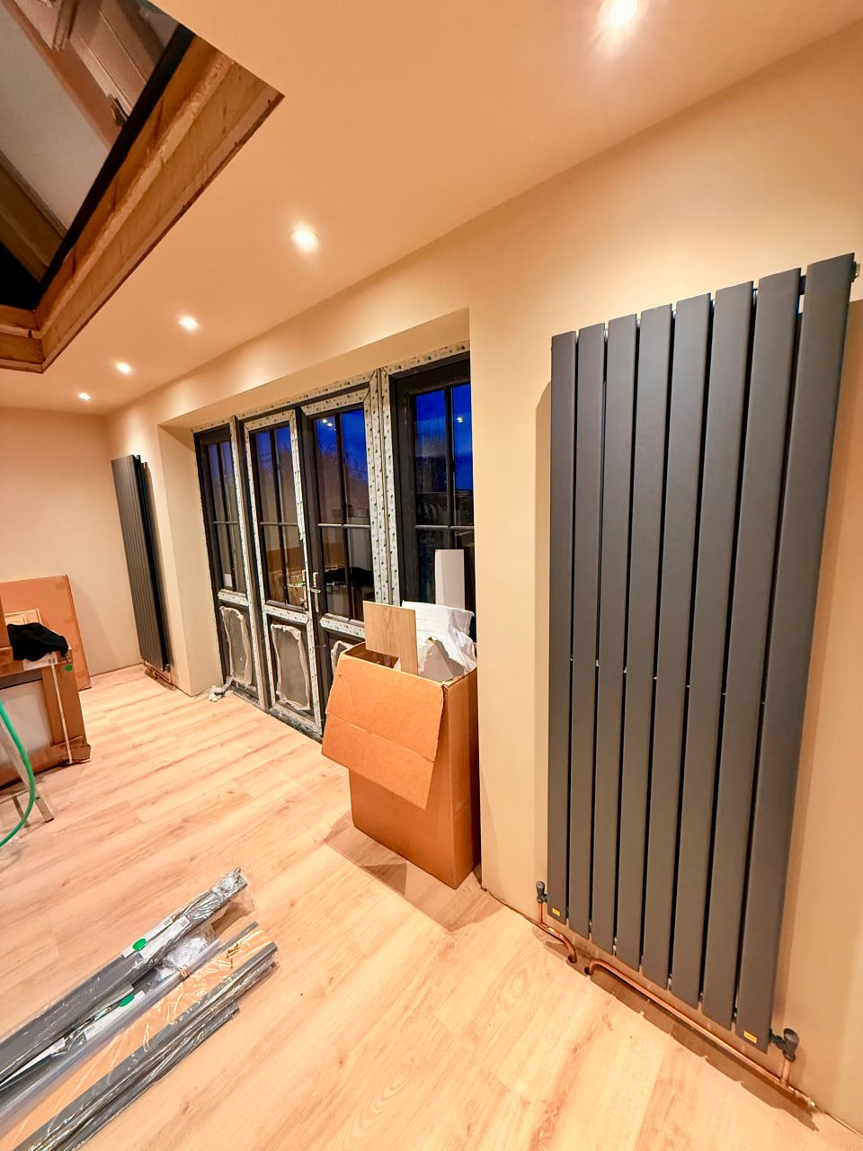 Completed radiator installation with pipework