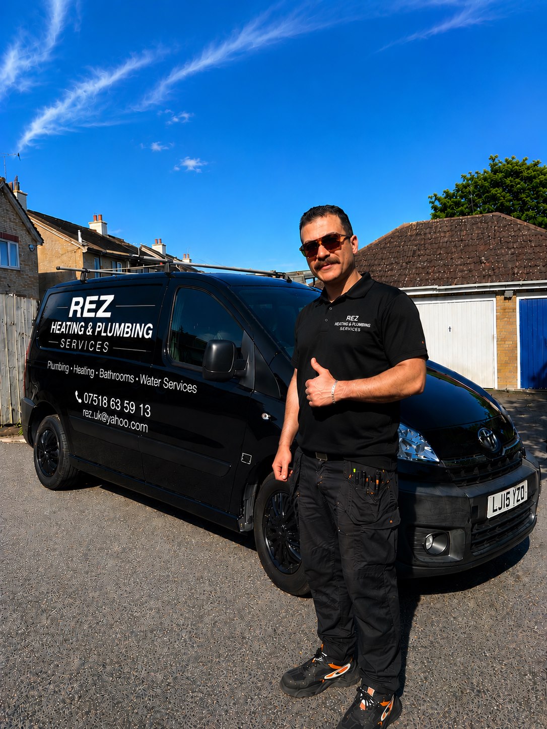 Rez Heating and Plumbing Services plumber beside branded van in Colchester